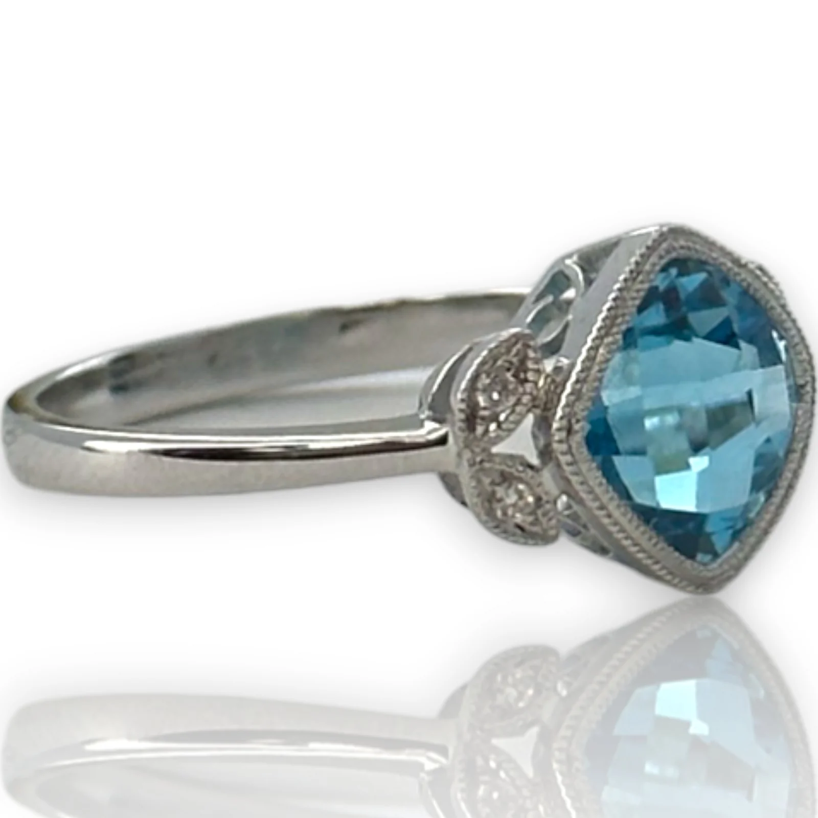 Legacy Custom Jewelers Solid 14kt White Gold and Checkerboard Cut Bezel Set Blue Topaz Ring with Diamond Leaf Milgrain Details Size 7 - Image 2